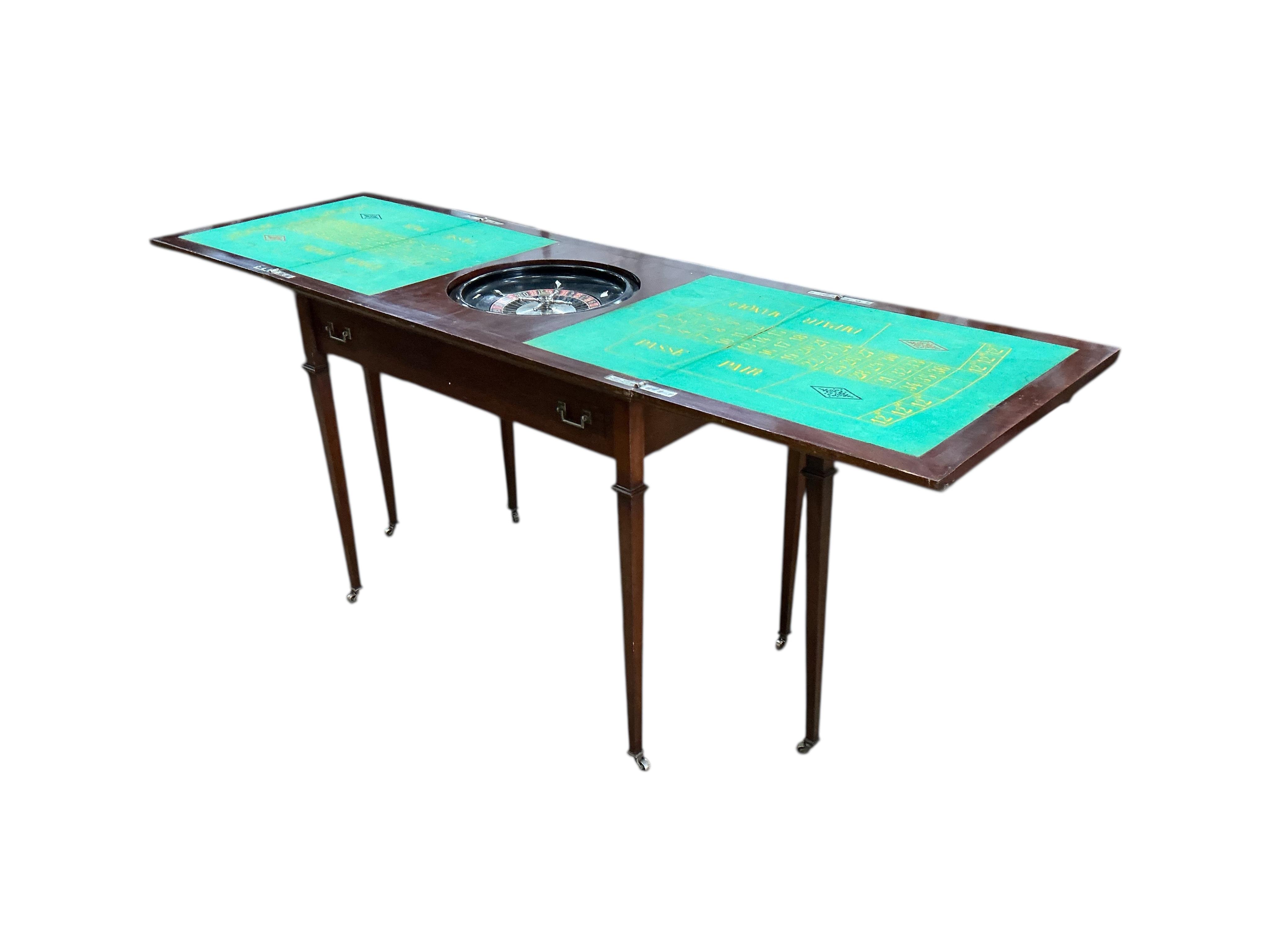 A rectangular mahogany roulette table with twin flap top, width 92cm, depth 57cm, height 77cm
